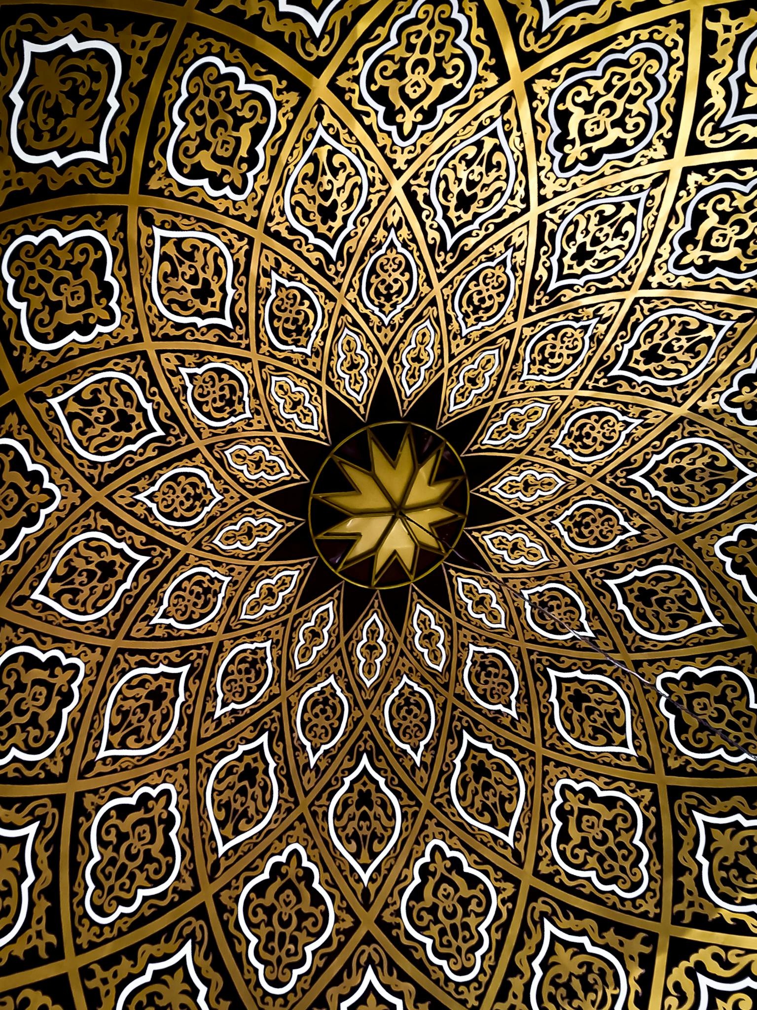 A stunning geometric and ornate pattern, reminiscent of kaleidoscope art, featuring intricate designs and rich colors.