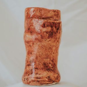 Intricately crafted ceramic sculpture featuring earthy tones, perfect for home decor or artistic collections.