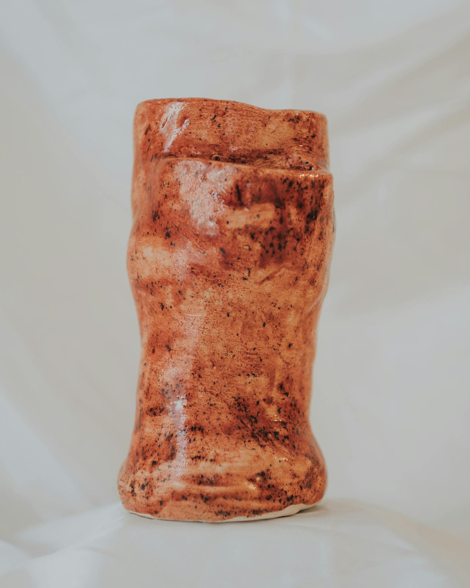 Intricately crafted ceramic sculpture featuring earthy tones, perfect for home decor or artistic collections.