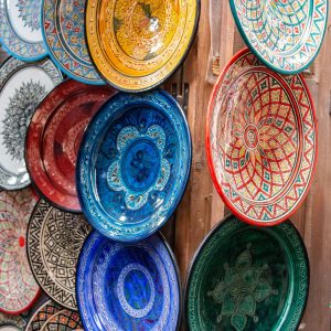 Vibrant display of ornate ceramic plates showcasing traditional craftsmanship.