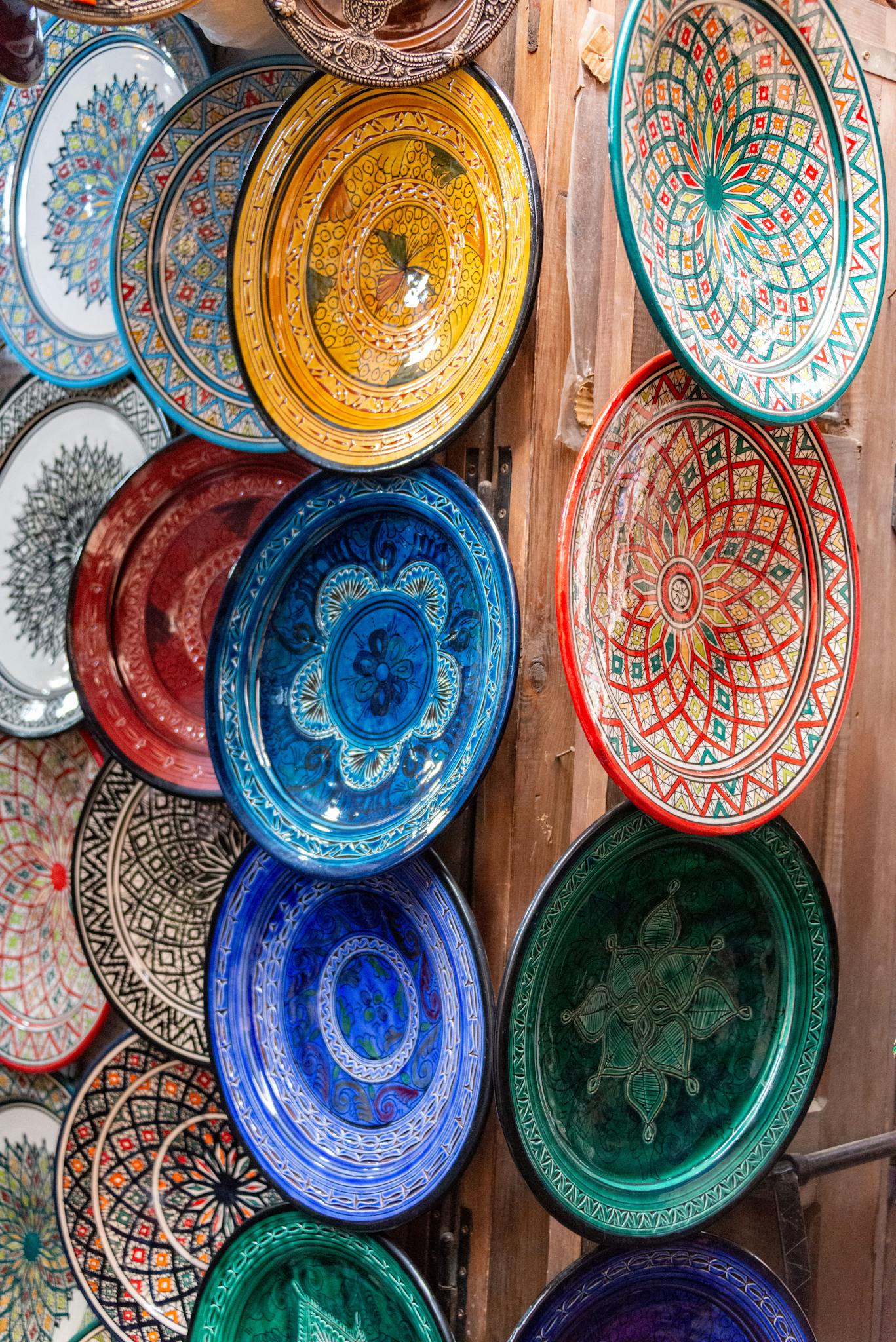 Vibrant display of ornate ceramic plates showcasing traditional craftsmanship.